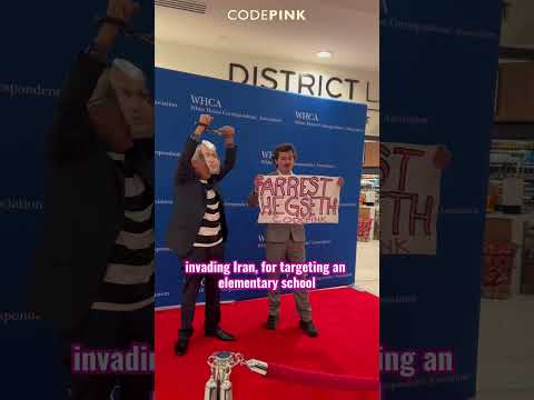 PEACE ACTIVISTS REMOVED BY FORCE  WHILE WAR CRIMINALS PARTY INSIDE