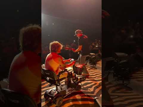 Jakob from Sublime Rolls on Stage with Broken Knee