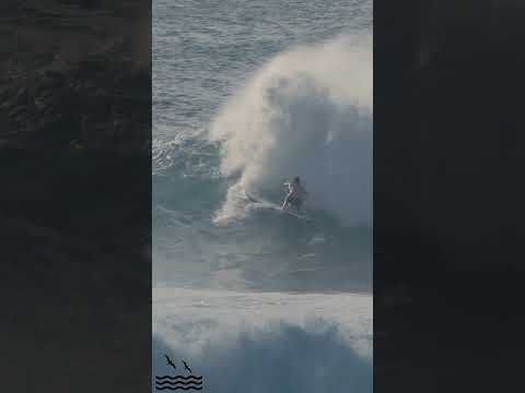 FINLESS BIG WAVE SURFER TAKES OFF